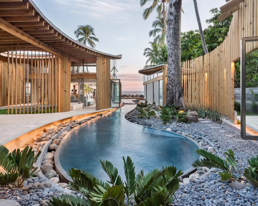 luxury beachfront villa with modern wood design and tranquil pool